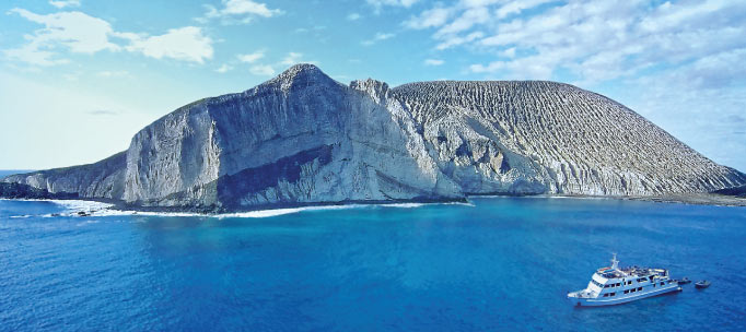 nautilus explorer sails by san benedicto island's cinder cone